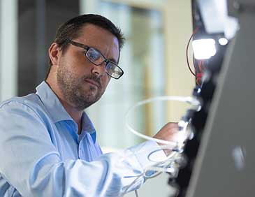 Engineering technology student working with electronics equipment