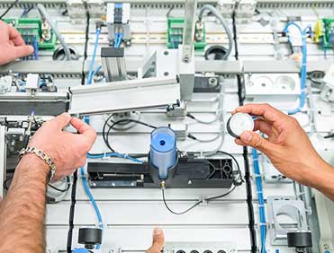Engineering technology student working with hardware