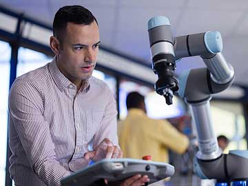 Engineering technology student in a technology classroom