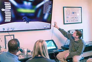 Student using a robotic system in a technology lab