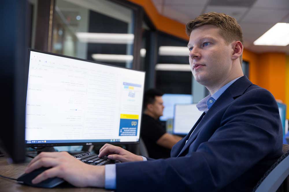Information technology student working at a computer