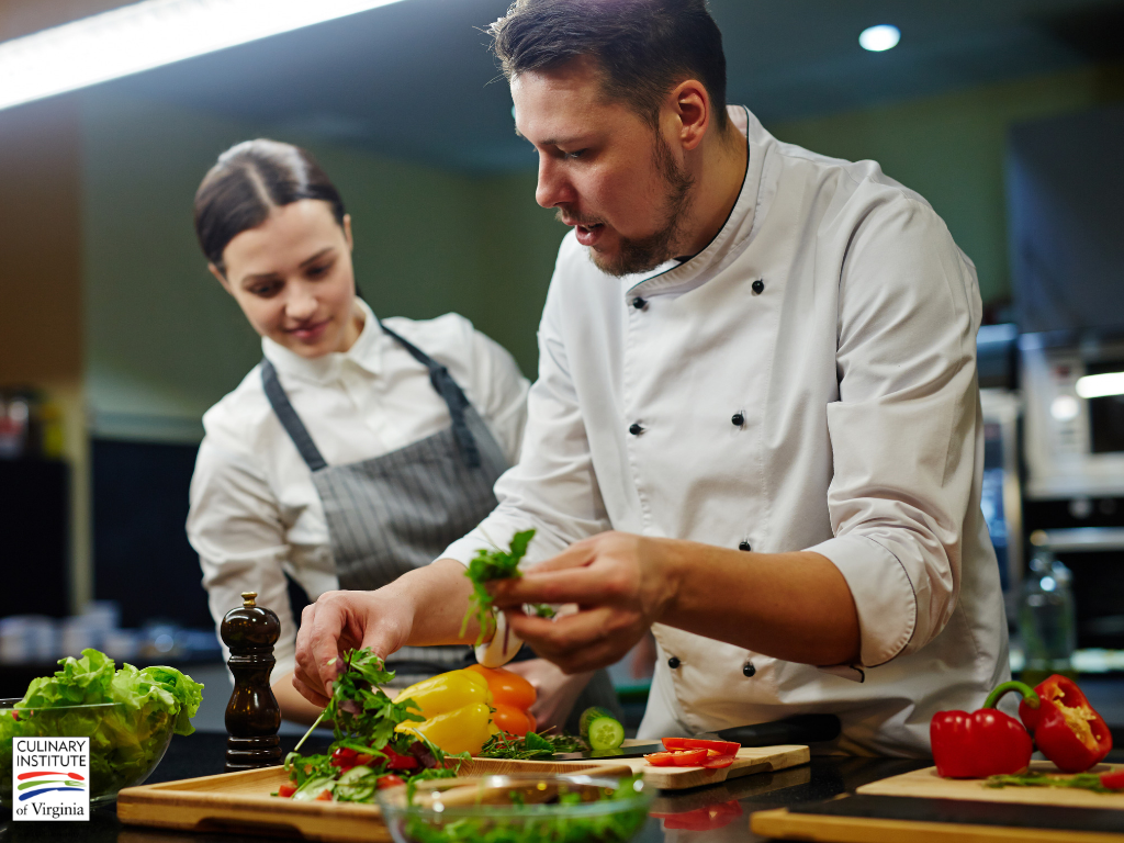 Male Chef teaching a female student